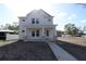 Two-story house with white siding, stone accents, and a front porch at 7428 Burlington N Ave, St Petersburg, FL 33710