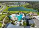 Aerial view of community pool, playground, and clubhouse at 8308 Reefbay Cv, Parrish, FL 34219