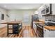 Modern kitchen with butcher block island and stainless steel appliances at 1325 W North B St, Tampa, FL 33606