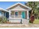 Updated bungalow exterior, featuring a teal front door at 1325 W North B St, Tampa, FL 33606