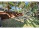 Large backyard space with a wooden fence and grassy area at 1325 W North B St, Tampa, FL 33606