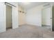 Well-lit bedroom with barn door to closet and carpet at 1325 W North B St, Tampa, FL 33606