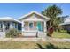 Quaint bungalow-style home with teal door and front porch at 1325 W North B St, Tampa, FL 33606