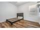 Cozy bedroom with grey platform bed and wood-look floors at 1325 W North B St, Tampa, FL 33606