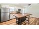 Updated kitchen featuring wood look floors and an island at 1325 W North B St, Tampa, FL 33606