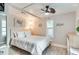 Spacious bedroom with a queen-size bed and ceiling fan at 5501 43Rd N St, St Petersburg, FL 33714