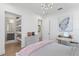 Charming bedroom with built-in shelves and a stylish vanity at 5104 W Evelyn Dr, Tampa, FL 33609