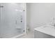 Bathroom with a large walk-in shower and built-in shelving at 5104 W Evelyn Dr, Tampa, FL 33609