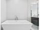 Modern freestanding bathtub with a sleek design at 5104 W Evelyn Dr, Tampa, FL 33609