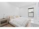 Spacious bedroom with a plush bed, light colored walls and plenty of natural light at 5104 W Evelyn Dr, Tampa, FL 33609