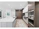Modern kitchen with custom cabinetry and a large island at 5104 W Evelyn Dr, Tampa, FL 33609
