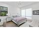 Bright bedroom with a comfortable bed and plenty of natural light at 5104 W Evelyn Dr, Tampa, FL 33609