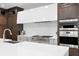 Modern kitchen features high-end stainless steel appliances and ample cabinetry at 5104 W Evelyn Dr, Tampa, FL 33609