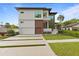 Modern two-story house with a two car garage at 5104 W Evelyn Dr, Tampa, FL 33609