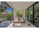 Relaxing patio with comfy seating, offering pool and backyard views at 5104 W Evelyn Dr, Tampa, FL 33609