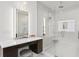 Modern bathroom vanity with lit mirror and quartz countertop at 5104 W Evelyn Dr, Tampa, FL 33609