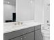 Clean bathroom with a gray vanity and white subway tile at 5104 W Evelyn Dr, Tampa, FL 33609