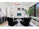 Spacious home office with large windows and stylish furnishings at 5104 W Evelyn Dr, Tampa, FL 33609