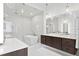 Spa-like bathroom with soaking tub and glass shower at 5104 W Evelyn Dr, Tampa, FL 33609