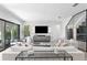 Bright living room with modern decor and access to patio at 5104 W Evelyn Dr, Tampa, FL 33609