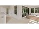 Outdoor kitchen with grill, seating area, and modern appliances at 5104 W Evelyn Dr, Tampa, FL 33609