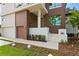 Modern house exterior with a wooden accent wall at 5104 W Evelyn Dr, Tampa, FL 33609