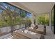Relaxing back patio with comfortable seating and lush landscaping at 5104 W Evelyn Dr, Tampa, FL 33609