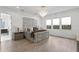 Spacious main bedroom with a large bed and hardwood floors at 5104 W Evelyn Dr, Tampa, FL 33609