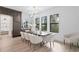 Bright dining room with a large table and modern light fixture at 5104 W Evelyn Dr, Tampa, FL 33609