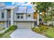 Modern two-story home with metal roof and attached garage at 5507 Interbay Blvd, Tampa, FL 33611