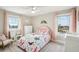 Charming bedroom with butterfly bedding, neutral walls, and natural light streaming through the window at 339 55Th Ave, St Pete Beach, FL 33706