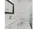 Bathroom with marble countertops, modern fixtures, and glass shower at 4586 Hickory Oak Dr, Brooksville, FL 34601