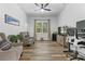 Living room/Office with hardwood floors, window view, and ceiling fan at 4586 Hickory Oak Dr, Brooksville, FL 34601