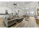 Bright, open-concept living space featuring luxury vinyl plank flooring, modern decor, and high ceilings at 4586 Hickory Oak Dr, Brooksville, FL 34601