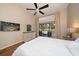 Bedroom with a white bed and a view of the screened-in pool area at 4944 Silverthorne Ct, Oldsmar, FL 34677