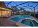 Relax in the screened-in pool and spa overlooking the golf course in this backyard retreat at 4944 Silverthorne Ct, Oldsmar, FL 34677