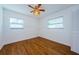 Bright bedroom with hardwood floors, ceiling fan and two windows at 6315 35Th N Ave, St Petersburg, FL 33710