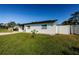 Side view of a charming house with a well-maintained lawn at 6315 35Th N Ave, St Petersburg, FL 33710