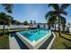 Inviting rectangular pool surrounded by lush landscaping and a pergola at 6315 35Th N Ave, St Petersburg, FL 33710