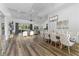 Open concept dining room with a large table and hardwood floors at 4586 Hickory Oak Dr, Brooksville, FL 34601