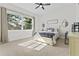 Bright bedroom with a queen-size bed and plenty of natural light at 4586 Hickory Oak Dr, Brooksville, FL 34601