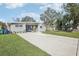 Mid-century modern home with a spacious driveway at 8010 N Lynn Ave, Tampa, FL 33604