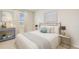 Comfortable bedroom with a queen-size bed and stylish nightstands at 10547 Bridgegate Heights Loop, San Antonio, FL 33576