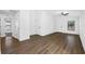 Spacious living room with wood-look flooring at 15108 Chimney Swift Rd, Weeki Wachee, FL 34614