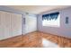 Bedroom with hardwood floors, double closets and nautical-themed decor at 90 S Highland Ave # 1115, Tarpon Springs, FL 34689