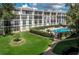 An aerial view of the community, showcasing its buildings and pool at 90 S Highland Ave # 1115, Tarpon Springs, FL 34689