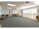 Spacious common area with comfortable seating for residents at 90 S Highland Ave # 1115, Tarpon Springs, FL 34689