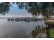 Peaceful boat dock with several boats and a view of the lake at 90 S Highland Ave # 1115, Tarpon Springs, FL 34689