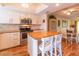 Modern kitchen with island and white cabinets at 90 S Highland Ave # 1115, Tarpon Springs, FL 34689