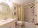 Simple bathroom with shower/tub combo, white vanity, and light green walls at 90 S Highland Ave # 1115, Tarpon Springs, FL 34689